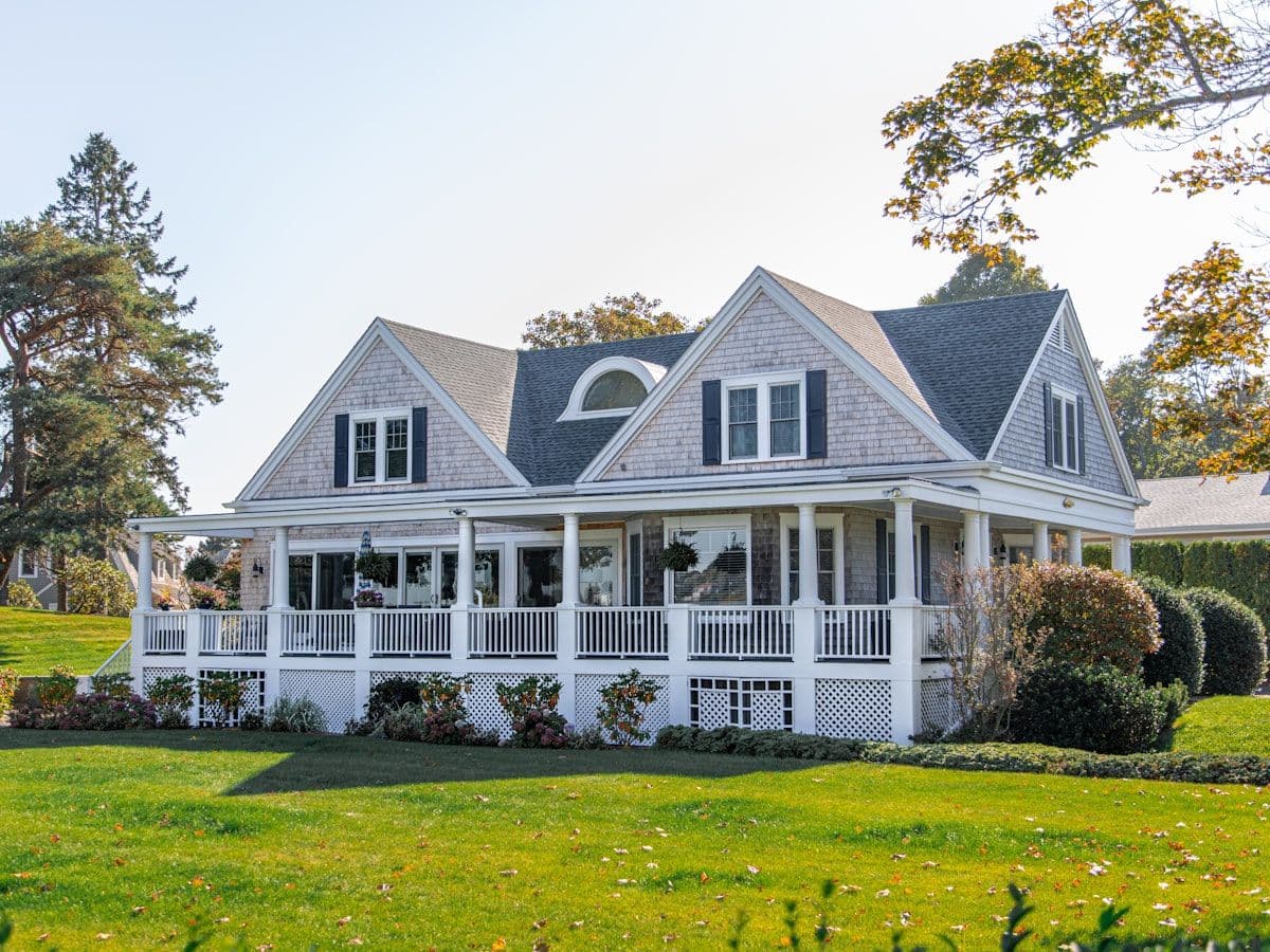 Same house with green, healthy-looking lawn and enhanced landscaping