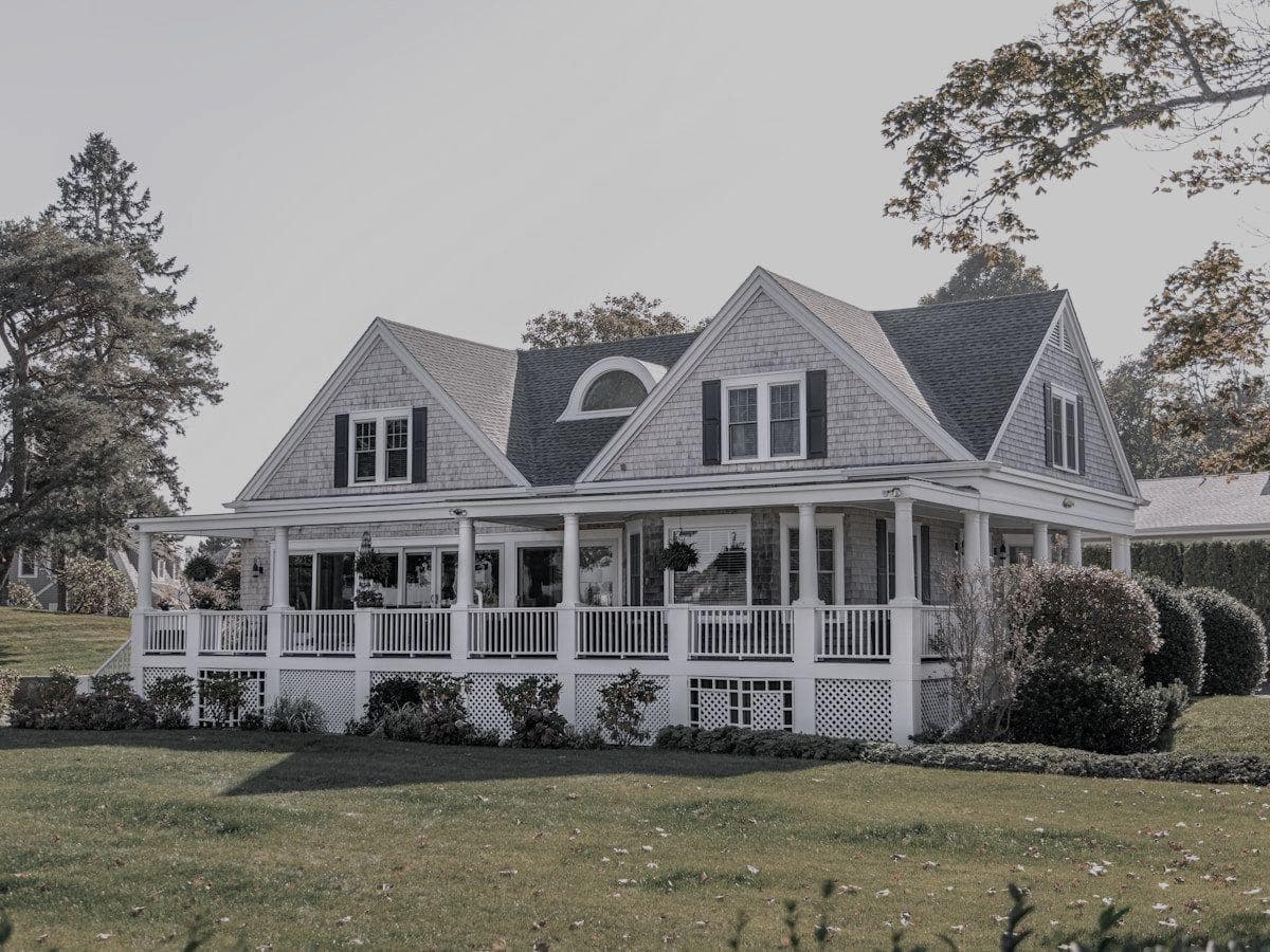 House with brown, patchy lawn and dry landscaping