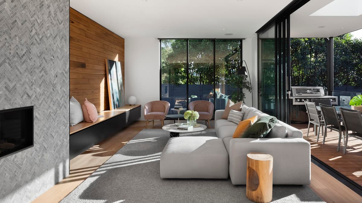 Empty room with large windows and hardwood floors photographed with proper technique