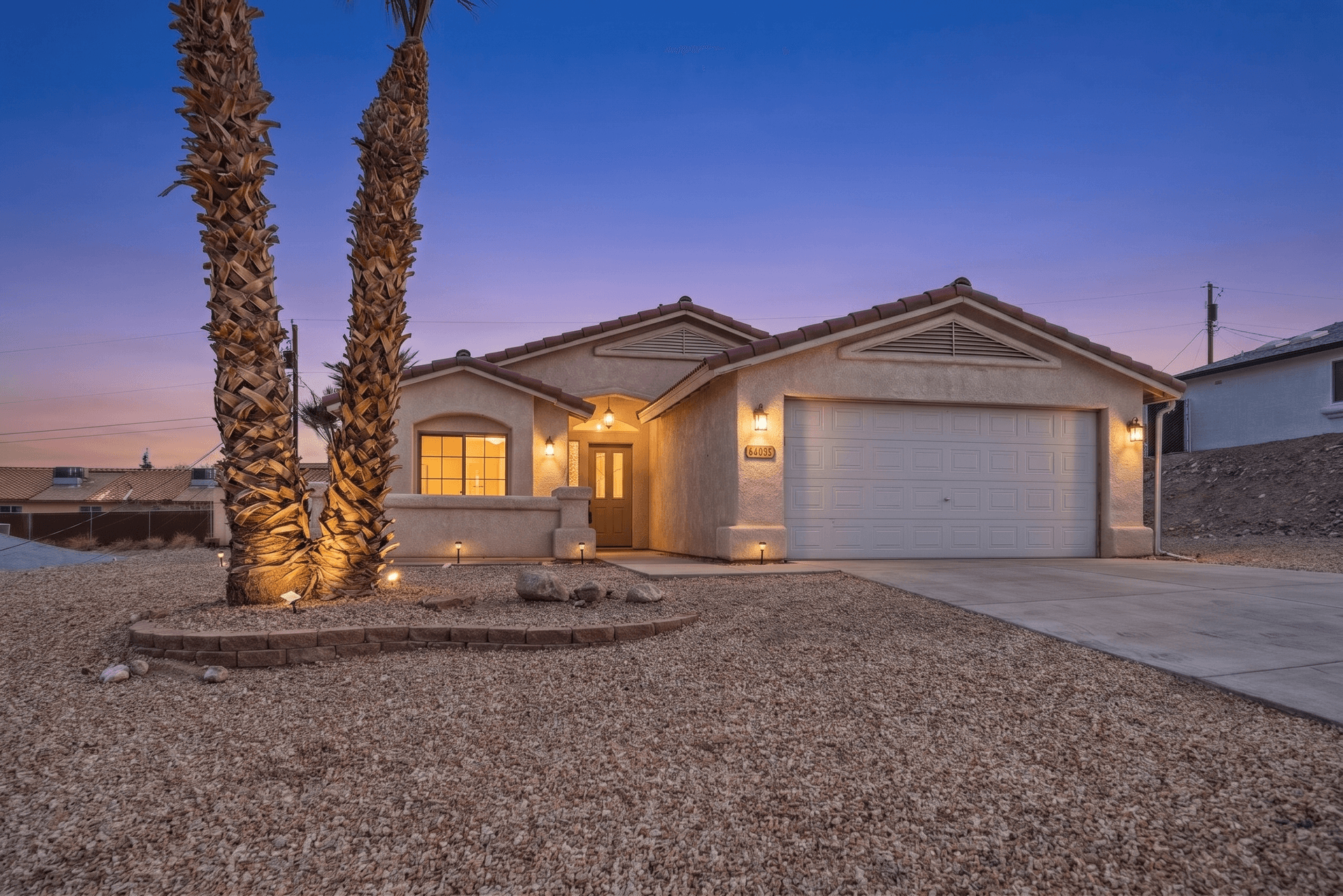 Front elevation at dusk — after