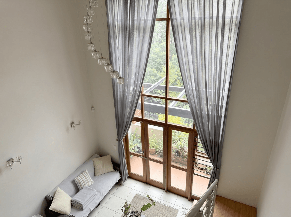Same bedroom with corrected white balance showing clean, fresh white linens